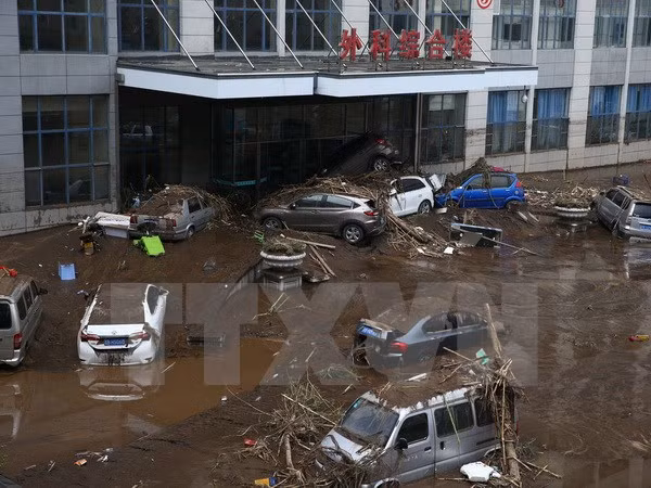 Cảnh ngập lụt sau những trận mưa lớn. (Ảnh: AFP/TTXVN)