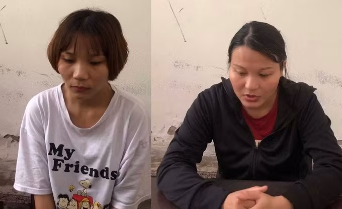 Uông Thị Trang (áo đen) cùng em gái tại cơ quan điều tra. Ảnh: Công an cung cấp.