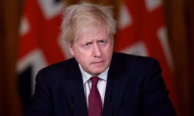 Thủ tướng Anh Boris Johnson công bố lệnh phong tỏa thủ đô và khu vực đông nam dịp Giáng sinh trong cuộc họp báo trên truyền hình hôm 19/12. Ảnh: AFP.