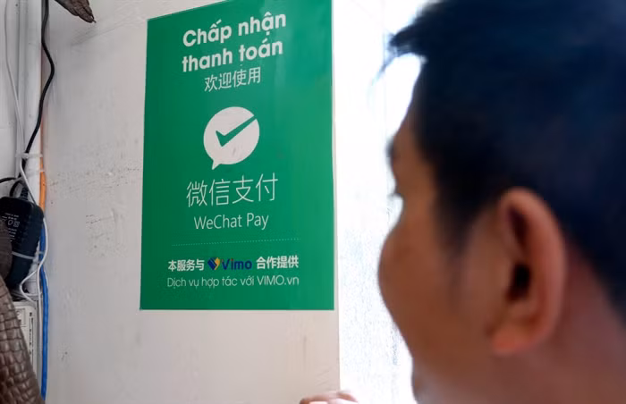 Một cửa hàng trên đường Nguyễn Thiện Thuật chấp nhận phương thức thanh toán bằng Wechat Pay
