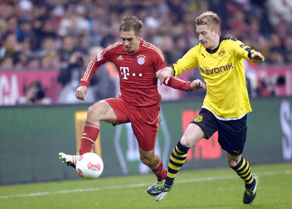 Marco Reus và Philipp Lahm, hai cầu thủ Đức nổi bật trong đội hình của Dortmund và Bayern
