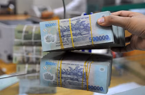 Doanh nghiệp vẫn than khó tiếp cận lãi suất thấp. Ảnh: Hoàng Hà