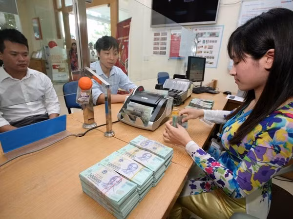 Thông tư 09 sẽ đẩy nhanh tiến trình cơ cấu lại ngân hàng. (Ảnh: Trần Việt/TTXVN).