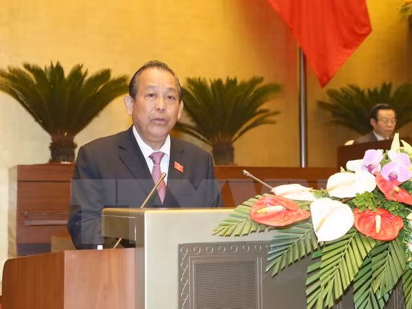 Phó Thủ tướng Thường trực Chính phủ Trương Hòa Bình trình bày Báo cáo. (Ảnh: Doãn Tấn/TTXVN)