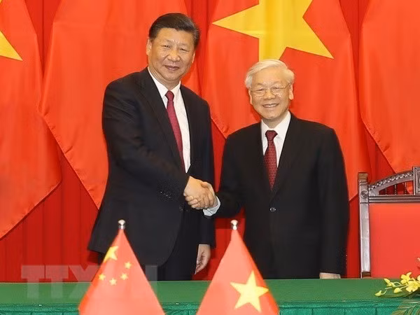 Tổng Bí thư, Chủ tịch nước Nguyễn Phú Trọng (phải) và Tổng Bí thư, Chủ tịch nước Trung Quốc Tập Cận Bình. (Ảnh: Trí Dũng/TTXVN)