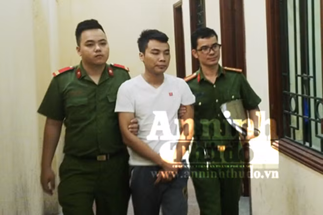 Đối tượng Trịnh Ngọc Tuấn ( áo trắng) - đối tượng lái xe tải đâm thẳng vào cảnh sát giao thông. (Nguồn: anninhthudo.vn) 