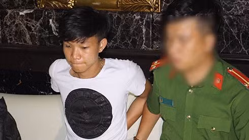  Nghi phạm Nghĩa khi bị công an bắt giữ. Ảnh: N.T.