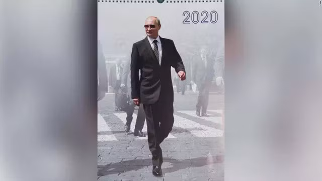 Tổng thống Nga Putin xuất hiện trên các trang lịch năm 2020 trong trang phục vest lịch lãm cùng cà vạt. Ảnh: CNN
