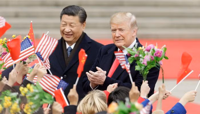 Chủ tịch Trung Quốc Tập Cận Bình (trái) và Tổng thống Mỹ Donald Trump trong chuyến thăm Bắc Kinh của ông Trump hồi tháng 11/2017. Ảnh: Bloomberg/CNBC