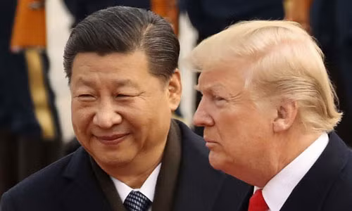 Tổng thống Mỹ Donald Trump (phải) và Chủ tịch Trung Quốc Tập Cận Bình trong cuộc gặp ở Bắc Kinh năm 2017. Ảnh: Reuters.