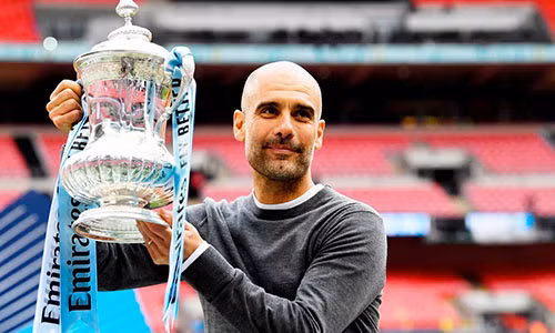 Guardiola hoàn tất cú ăn ba cùng Man City khi đoạt Cup FA cuối tuần trước. Ảnh: PA.