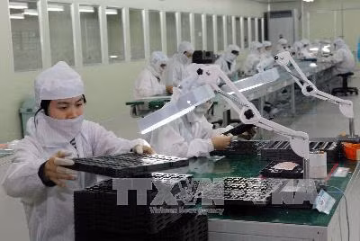 Sản xuất khay nhựa, hộp nhựa đựng linh kiện điện tử tại Khu công nghiệp Đình Trám (Bắc Giang). Ảnh: Danh Lam/TTXVN