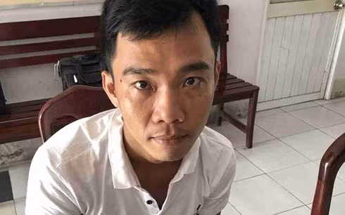 Minh bị cảnh sát bắt sau thời gian lẩn trốn ở Cần Thơ. Ảnh CA.