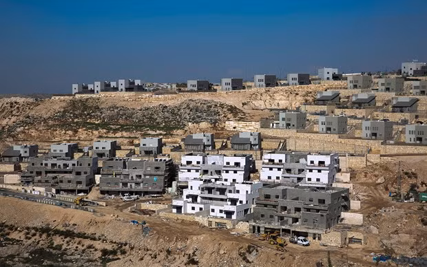 Israel tạm dừng tuyên bố chủ quyền ở các khu định cư Bờ Tây. (Ảnh: AP)