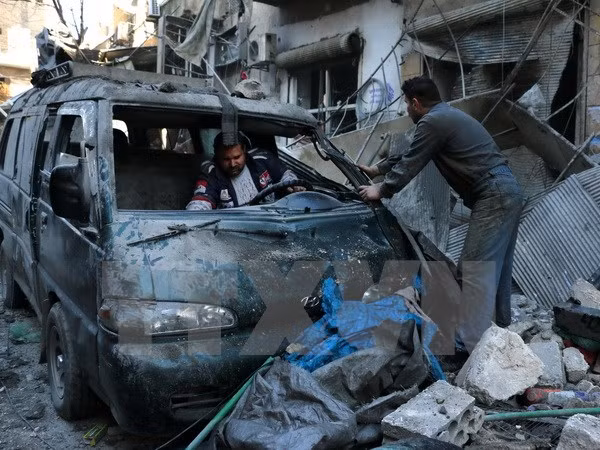 Cảnh đổ nát sau các cuộc giao tranh giữa quân đội chính phủ và phiến quân tại thành phố Aleppo, miền Nam Syria ngày 16/1. (Nguồn: AFP/TTXVN)