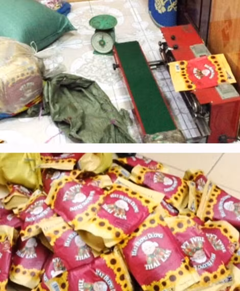 Tang vật nhưng bao hạt hướng dương giả mác Thái Lan, máy ép, cân bàn bị công an bắt quả tang tại cơ sở sán xuất của Thức. (Ảnh: CTV)