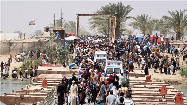 Người dân Iraq tháo chạy khỏi Ramadi sau khi TP thất thủ - Ảnh: AFP