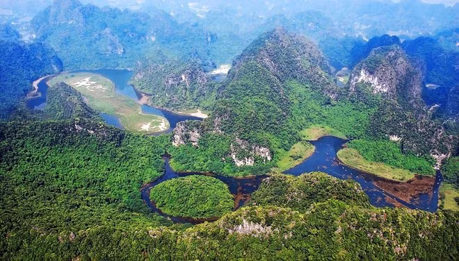 Ngày 23/1, Ninh Bình long trọng tổ chức lễ đón bằng của UNESCO ghi danh quần thể danh thắng Tràng An là Di sản văn hóa và thiên nhiên thế giới. Ảnh: BQL Quần thể danh thắng Tràng An.