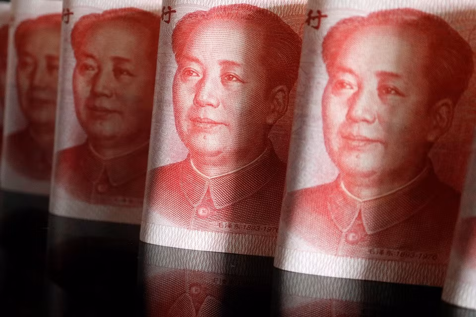Đồng nhân dân tệ sụt giảm khi tăng trưởng kinh tế Trung Quốc giảm tốc. Ảnh: Reuters.