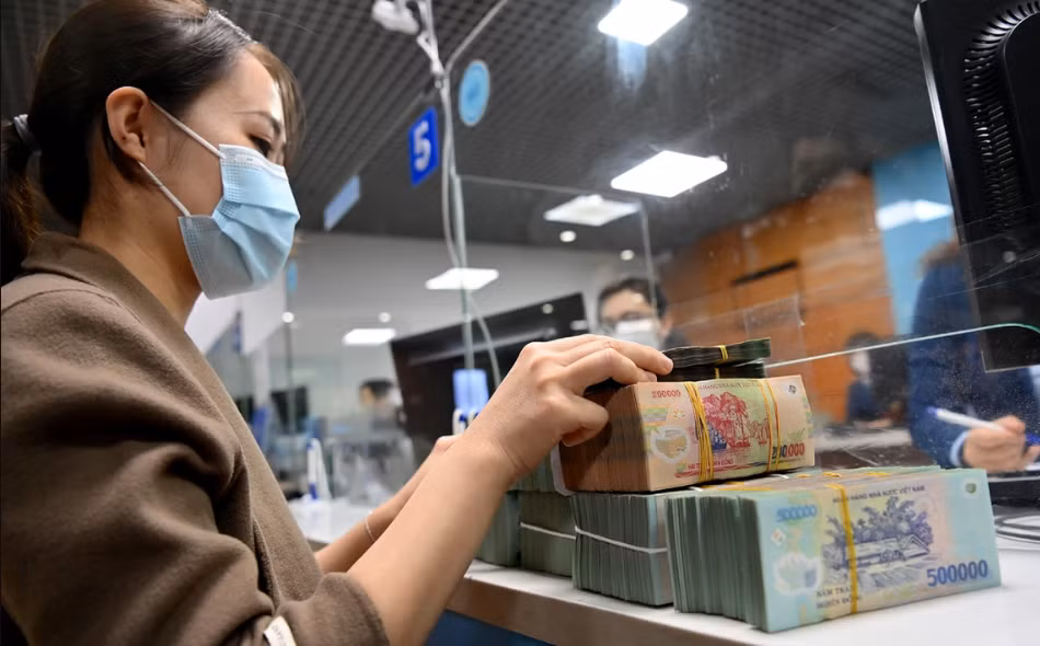 Xử lý nợ xấu ngân hàng có nhiều tín hiệu tích cực - Ảnh 1.