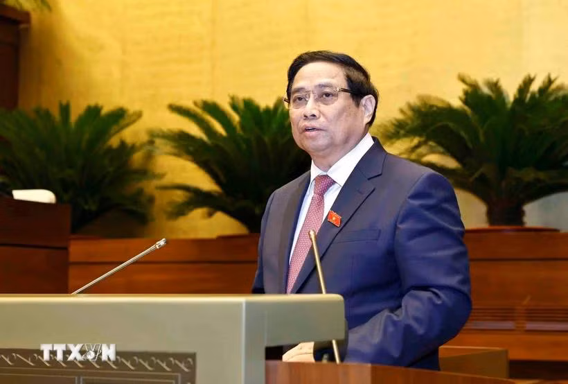 Thủ tướng Phạm Minh Chính trình bày Báo cáo kết quả thực hiện kế hoạch phát triển kinh tế-xã hội năm 2024, dự kiến kế hoạch phát triển kinh tế-xã hội năm 2025. (Ảnh: Doãn Tấn/TTXVN)