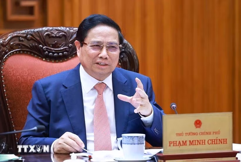 Thủ tướng Phạm Minh Chính chủ trì cuộc họp với với Bộ Giáo dục và Đào tạo; Bộ Y tế. (Ảnh: Dương Giang/TTXVN)