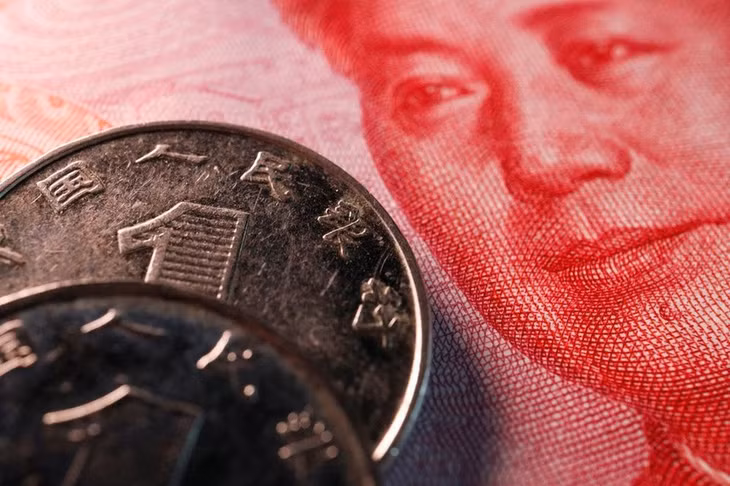 Đồng nhân dân tệ chịu sức ép bởi đà tăng của đồng USD. Ảnh: Reuters.