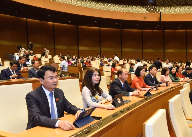 Quốc hội đã thông qua Nghị quyết kỳ họp thứ 3, Quốc hội khóa XV với tuyệt đại đa số đại biểu tán thành - Ảnh: VGP/Nhật Bắc