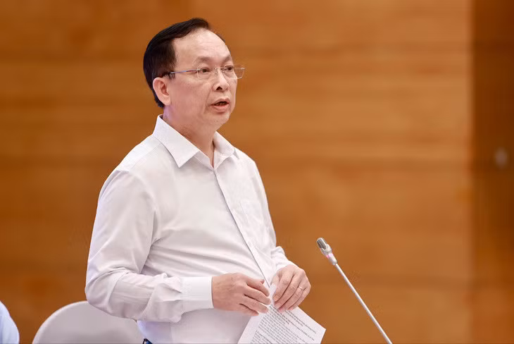 Phó thống đốc Ngân hàng Nhà nước Đào Minh Tú trả lời câu hỏi liên quan vụ khách hàng gửi tiền tại Ngân hàng MSB và bị mất - Ảnh: NGUYỄN KHÁNH