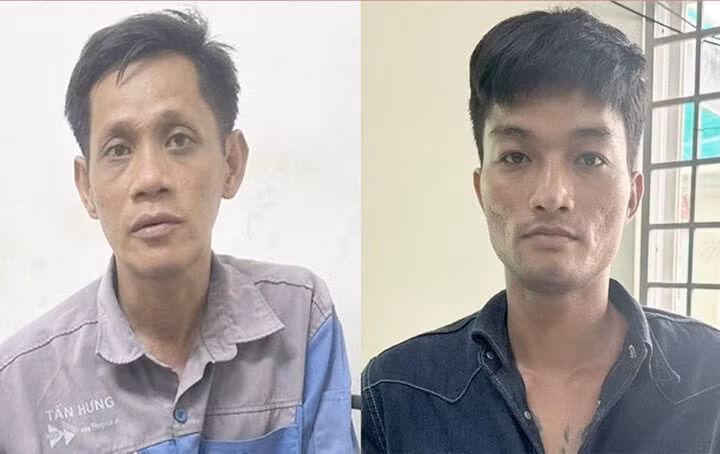 Vũ Đức Trí (phải) và Quan Uy Quang tại cơ quan công an.