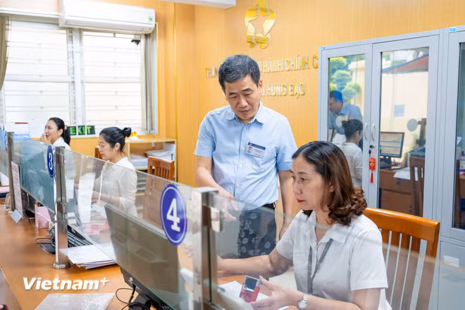 Các địa phương đang khẩn trương vận hành thử nghiệm chính quyền địa phương 02 cấp. (Ảnh: PV/Vietnam+)
