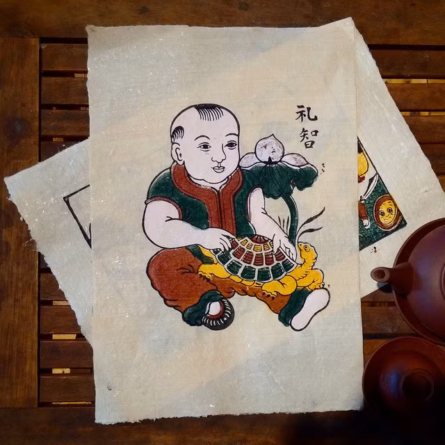 Tranh "Em bé ôm con rùa".
