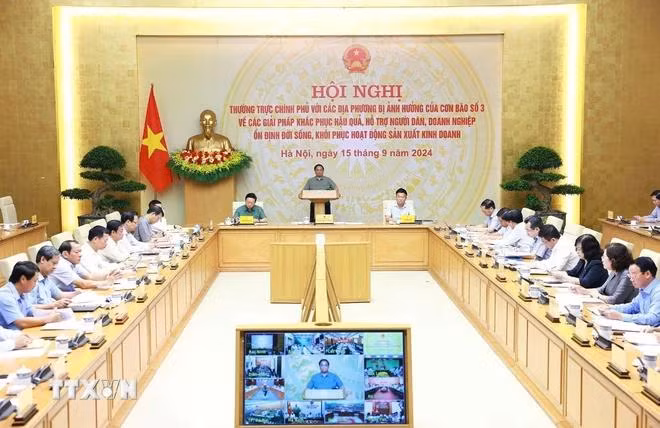 Thủ tướng Phạm Minh Chính chủ trì Hội nghị Thường trực Chính phủ với các địa phương về khắc phục hậu quả cơn bão số 3. (Ảnh: Dương Giang/TTXVN)