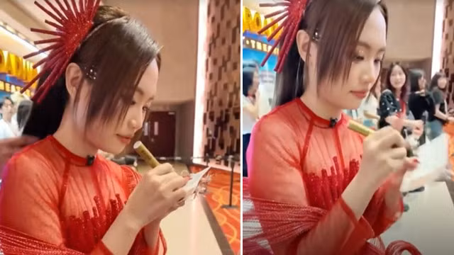Phương Mỹ Chi ký tặng fan tại Sing! Asia. Ảnh: Cắt từ clip