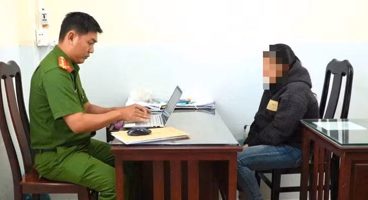 M. tại công an - Ảnh: Công an cung cấp
