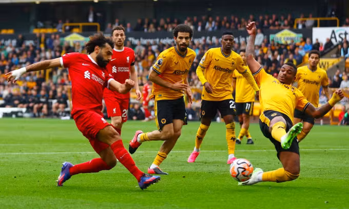Salah kiến tạo cho Cody Gakpo gỡ hòa 1-1. Ảnh: Reuters
