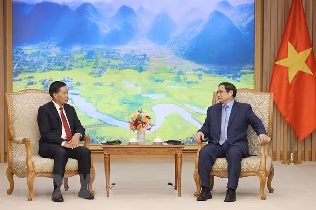 Thu tuong: Viet Nam luon quyet tam ke vai sat canh, ho tro Lao hinh anh 1