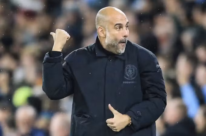 Biểu cảm của Guardiola với bàn thứ hai từ Haaland. Ảnh: AFP