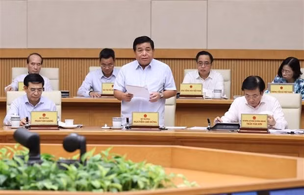 Bộ trưởng Bộ Kế hoạch và Đầu tư Nguyễn Chí Dũng báo cáo tình hình kinh tế - xã hội tháng 9 và 9 tháng năm 2022. (Ảnh: Dương Giang/TTXVN)