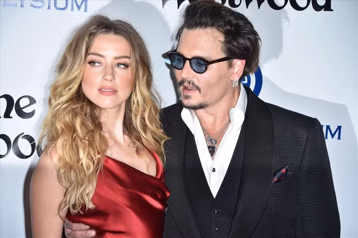 Amber Heard và Johnny Depp thuở còn mặn nồng. Ảnh: AFP.