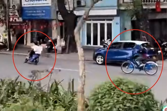 Nhóm thiếu niên điều khiển xe đạp điện lạng lách trên đường. Ảnh cắt từ clip