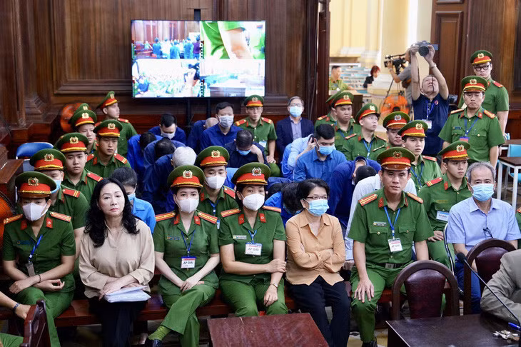 Các bị cáo tại phiên tòa sáng 19-3 - Ảnh: HỮU HẠNH