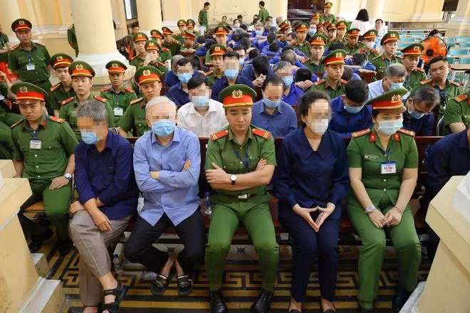 Các bị cáo tại phiên tòa ngày 14/3. (Ảnh: Thanh Vũ/TTXVN)