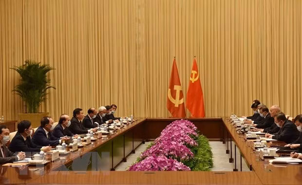 Doan dai bieu Dang Cong san Viet Nam tham va lam viec tai Trung Quoc hinh anh 1