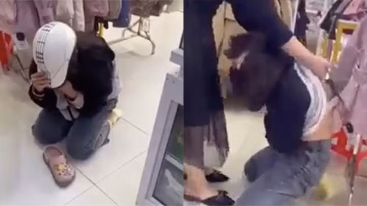Nữ sinh bị chủ cửa hàng và nhiều người hành hạ, làm nhục. (Ảnh cắt từ clip)