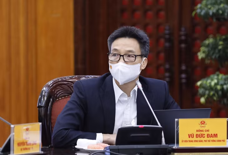 Phó Thủ tướng Vũ Đức Đam yêu cầu tăng cường thực hiện các giải pháp phòng, chống dịch COVID-19 trong dịp Tết Dương lịch 2022. Ảnh: TTXVN.