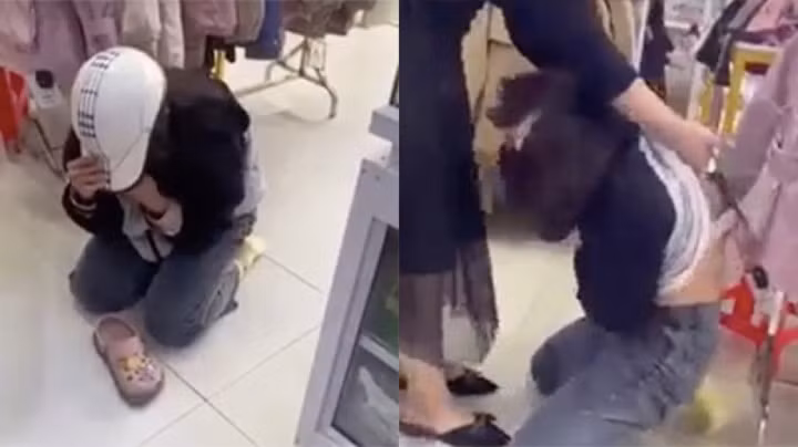 Nữ sinh bị chủ cửa hàng và nhiều người hành hạ, làm nhục. (Ảnh cắt từ clip)