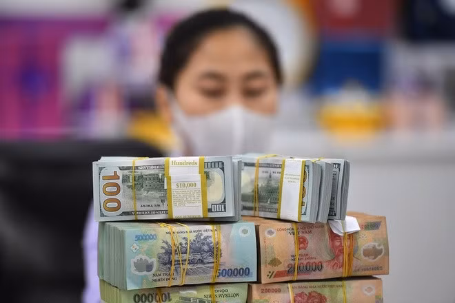 Trong 3 tháng gần nhất, Kho bạc Nhà nước đã thực hiện chào mua tới 750 triệu USD giao ngay từ các ngân hàng thương mại, tương đương hơn 17.000 tỷ đồng quy đổi. Ảnh: Nam Khánh.