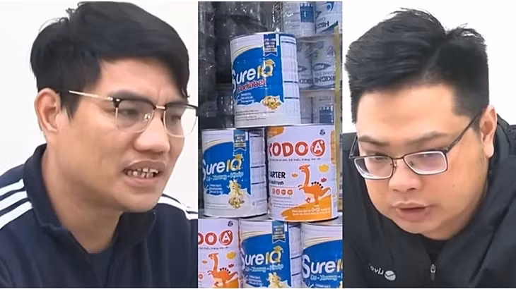 Hai bị can trong vụ án cùng tang vật là những hộp sữa giả bị thu giữ - Ảnh: VTV