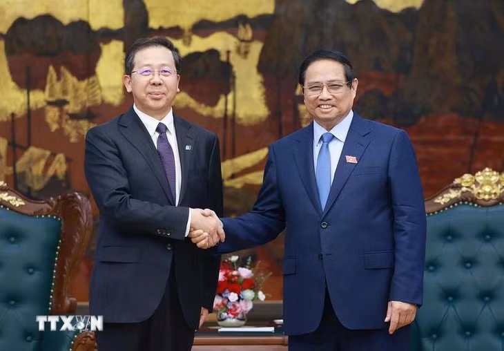 Thủ tướng Phạm Minh Chính tiếp ông Bành Cương Bình, Chủ tịch Công ty hữu hạn Tập đoàn Khoa học Kỹ thuật Hoa Điện Trung Quốc. (Ảnh: Dương Giang/TTXVN)
